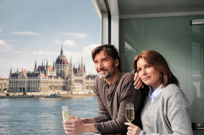 Couple in Budapest, in front of Parliament building