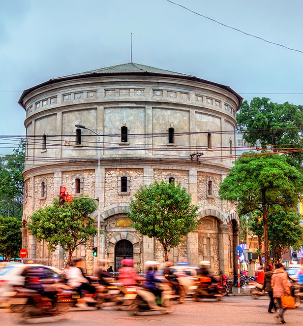 People rowing basket boats down a river in Hoi An