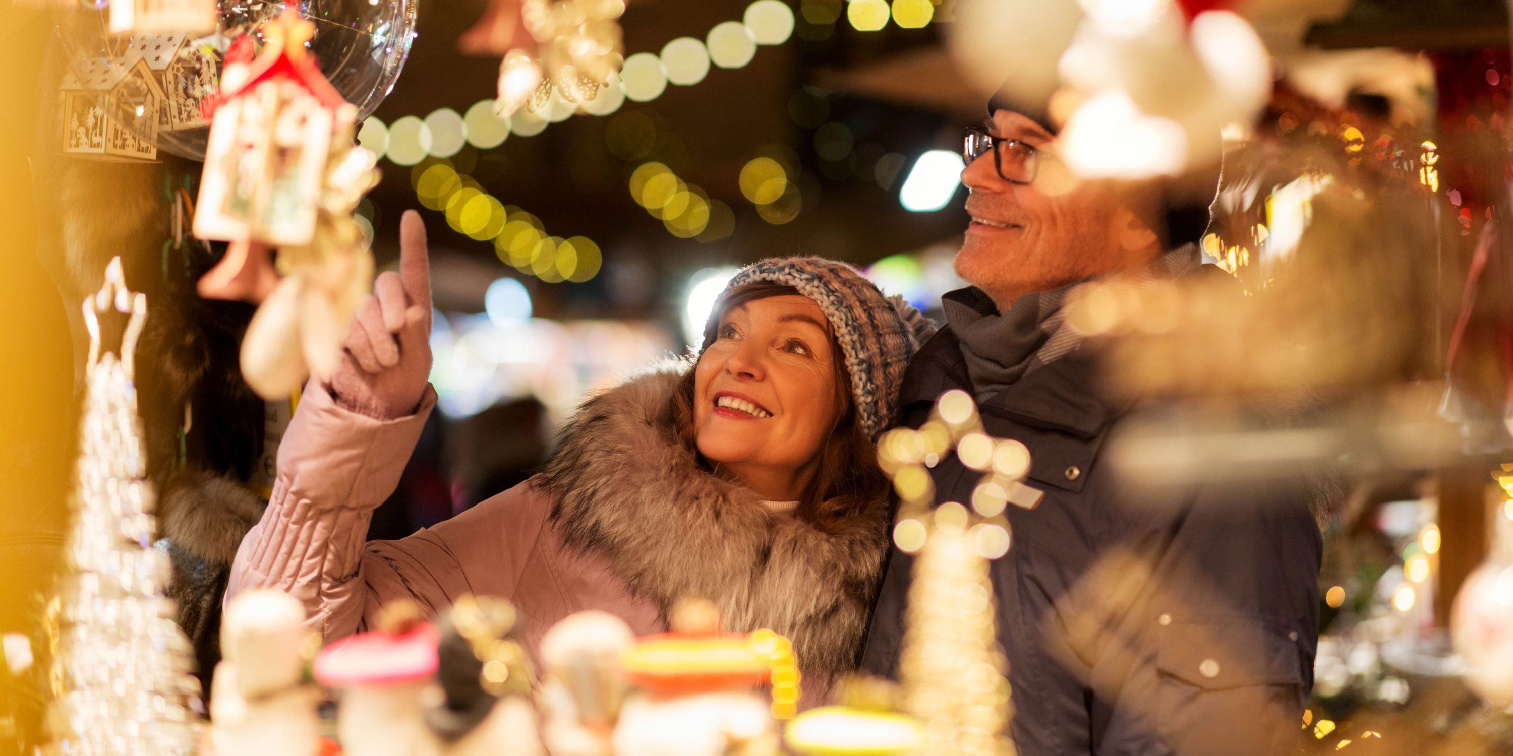 Couple admiring a European Christmas market stall