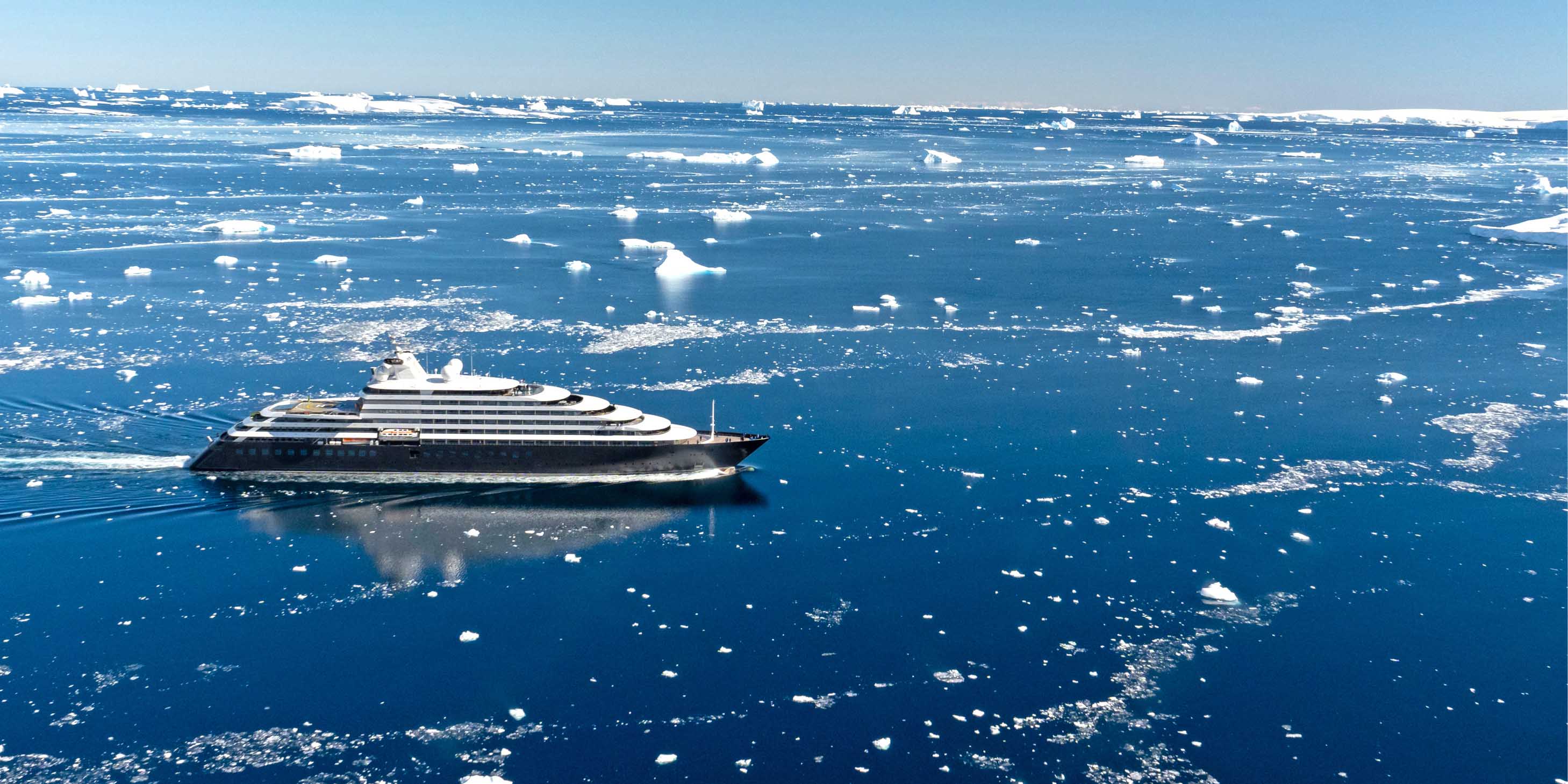 Luxury yacht "Scenic Eclipse I" sailing through Lemaire Channel in Antarctica.