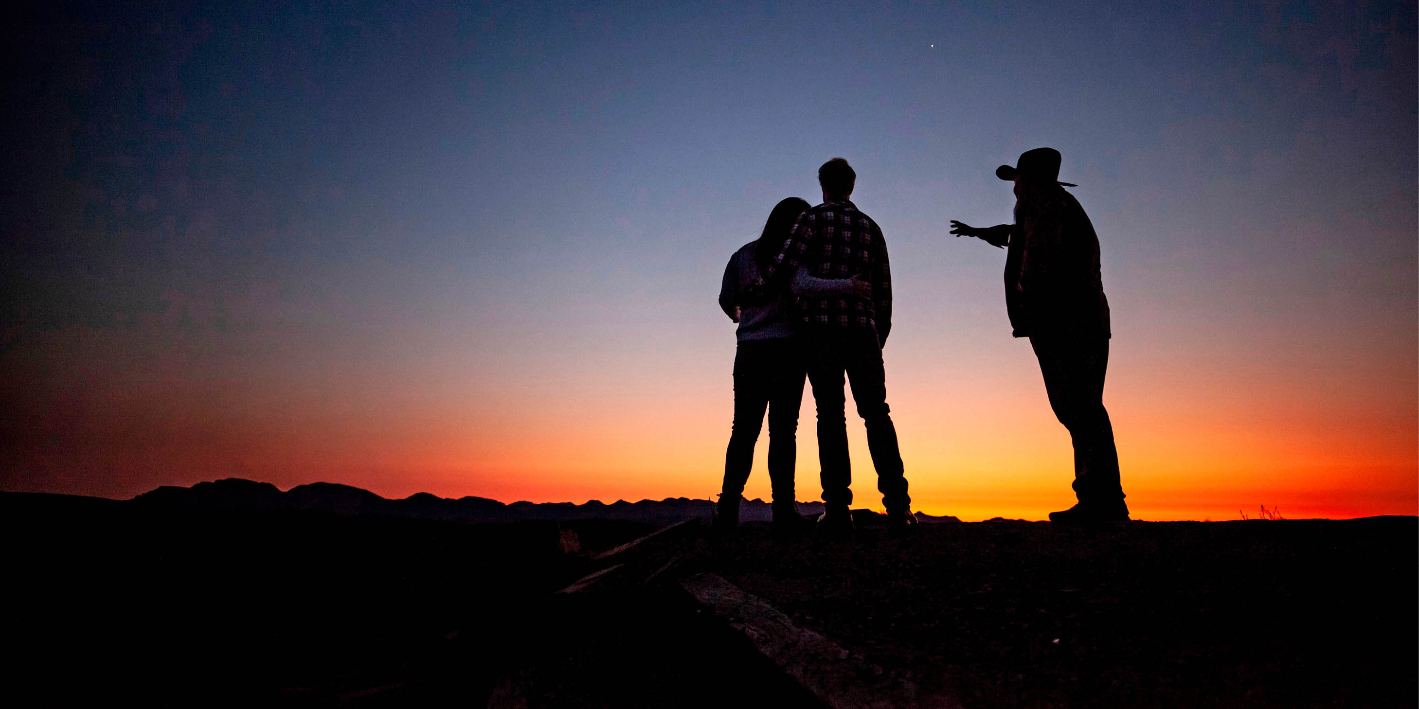 Looking at the sunset with a guide at Wilpena Pound, Australia.  
