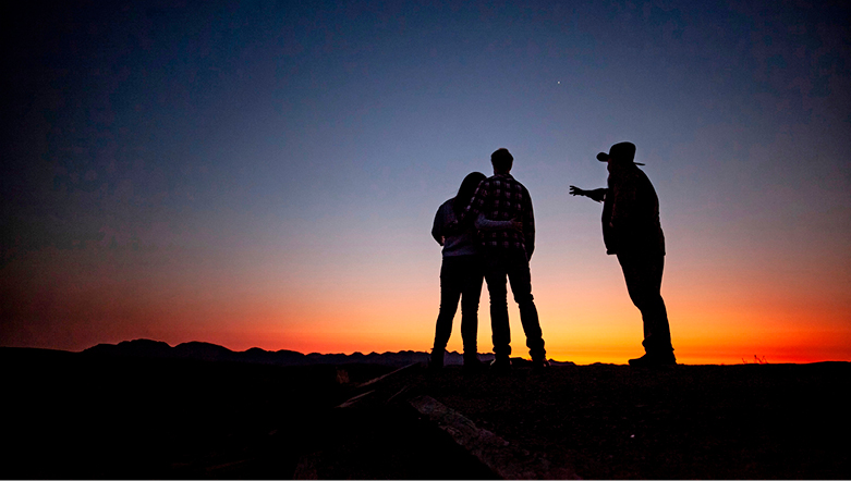Looking at the sunset with a guide at Wilpena Pound, Australia.  