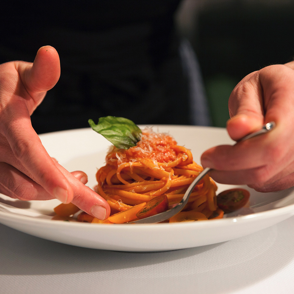 Gourmet spaghetti dish prepared by chef